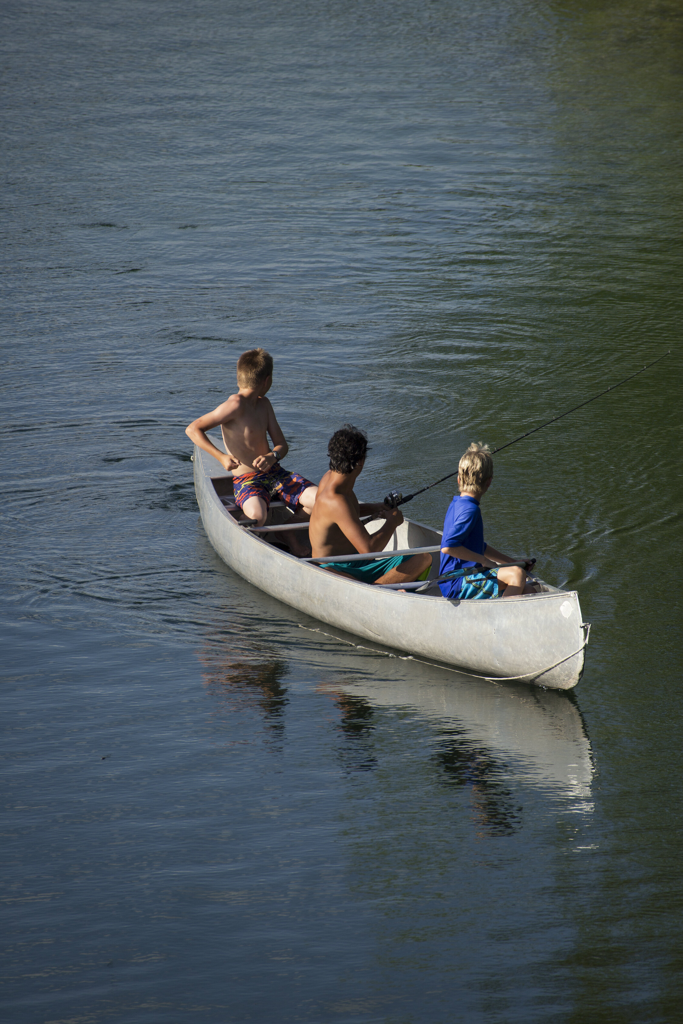 Selah Campers canoe and fish on the lake.